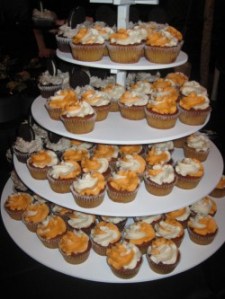 Creamsicle and chocolate cupcakes with Oreo frosting and a cookie on top.Photo by: Sandra Carr