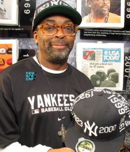 Spike Lee wearing New York Yankees gear.